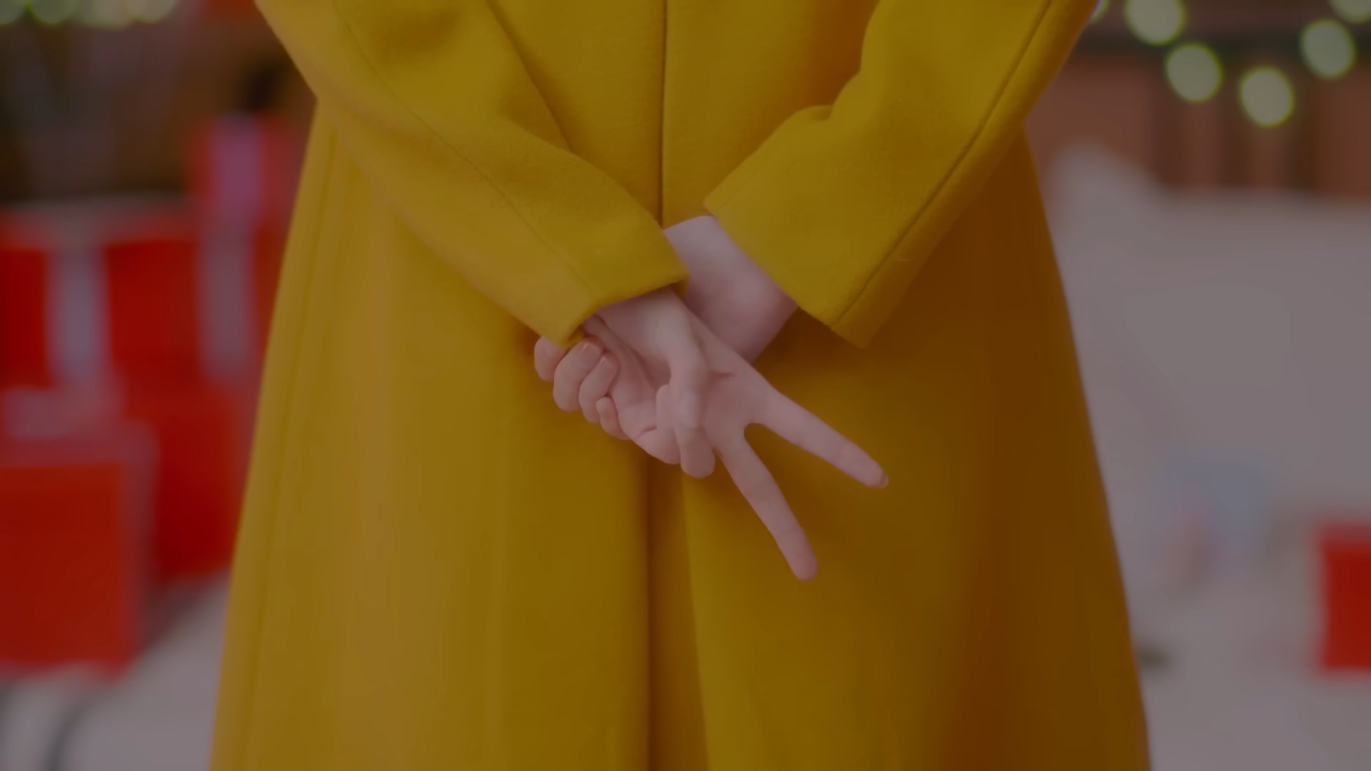 Hyunjin holding up two fingers.